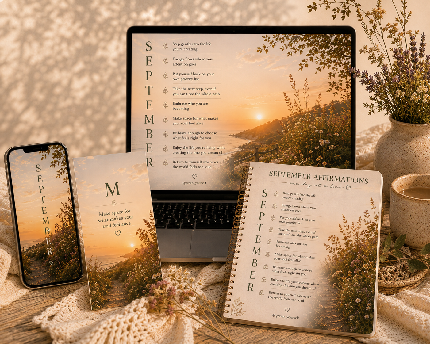 The September Calm Collection shown on a phone, a laptop and a printed affirmations page beside wildflowers at sunset
